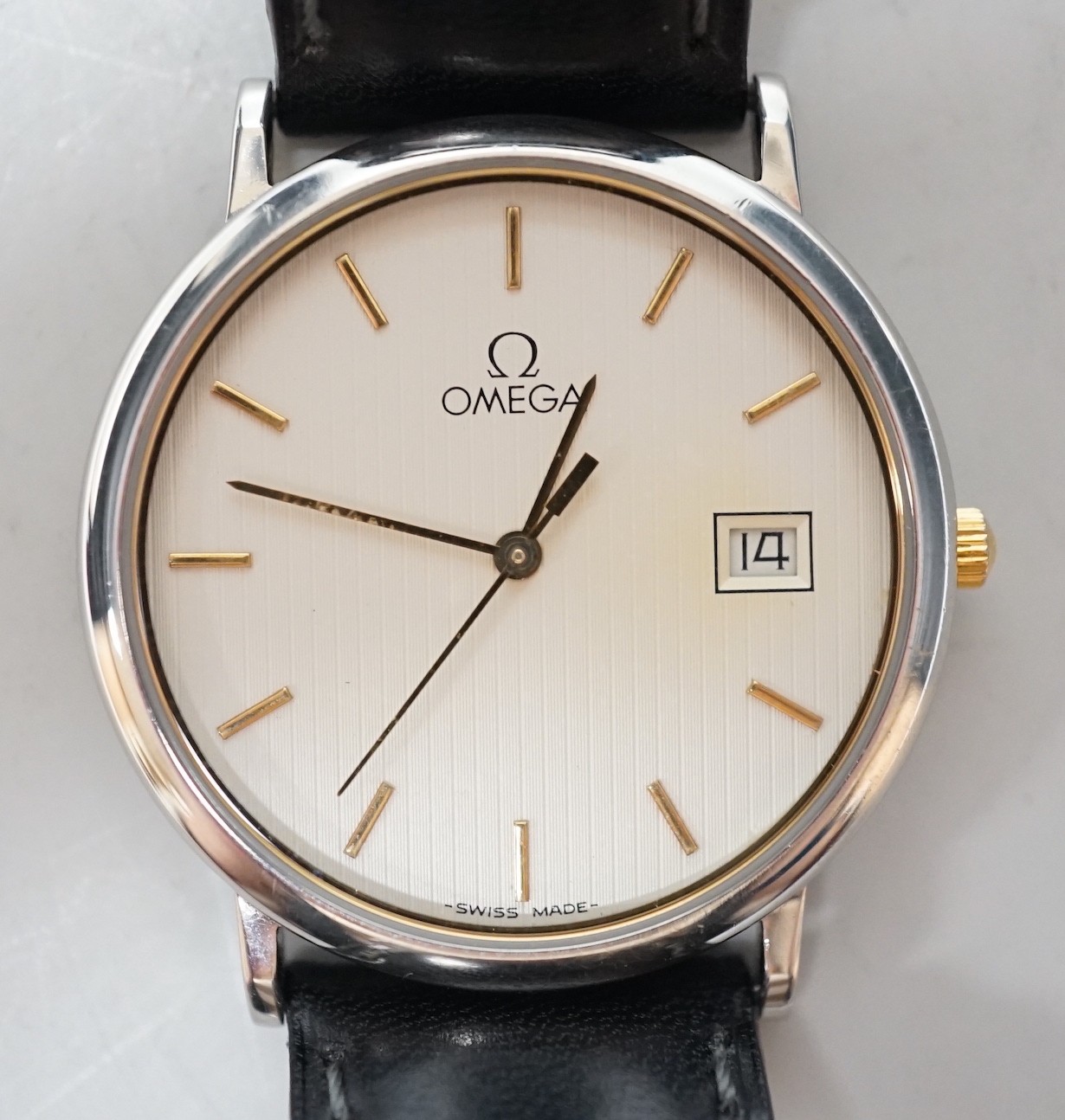 A gentleman's 1990's stainless steel Omega quartz dress wrist watch, with date aperture, case diameter 33mm, with box.